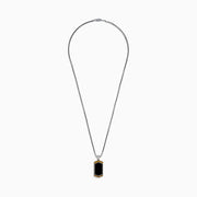 The Mens 925 Sterling Silver Onyx Pendant features a silver chain and a rectangular onyx pendant framed in silver, with a gold border and small gold studs accenting the top and bottom edges.