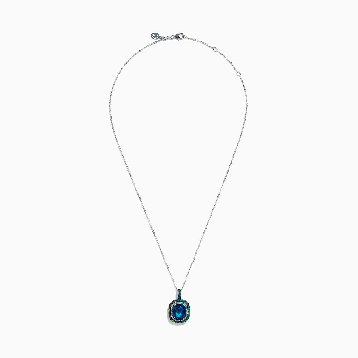 The 925 Sterling Silver Blue Topaz Cushion Multi Gemstone Halo Pendant features a cushion-cut blue topaz, accented by small blue and green stones in a striking halo design.