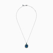 The 925 Sterling Silver Blue Topaz Cushion Multi Gemstone Halo Pendant features a cushion-cut blue topaz, accented by small blue and green stones in a striking halo design.