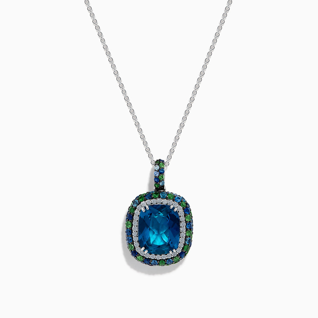The 925 Sterling Silver Blue Topaz Cushion Multi Gemstone Halo Pendant features a cushion-cut blue topaz, accented by small blue and green stones in a striking halo design.