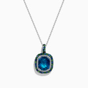 The 925 Sterling Silver Blue Topaz Cushion Multi Gemstone Halo Pendant features a cushion-cut blue topaz, accented by small blue and green stones in a striking halo design.