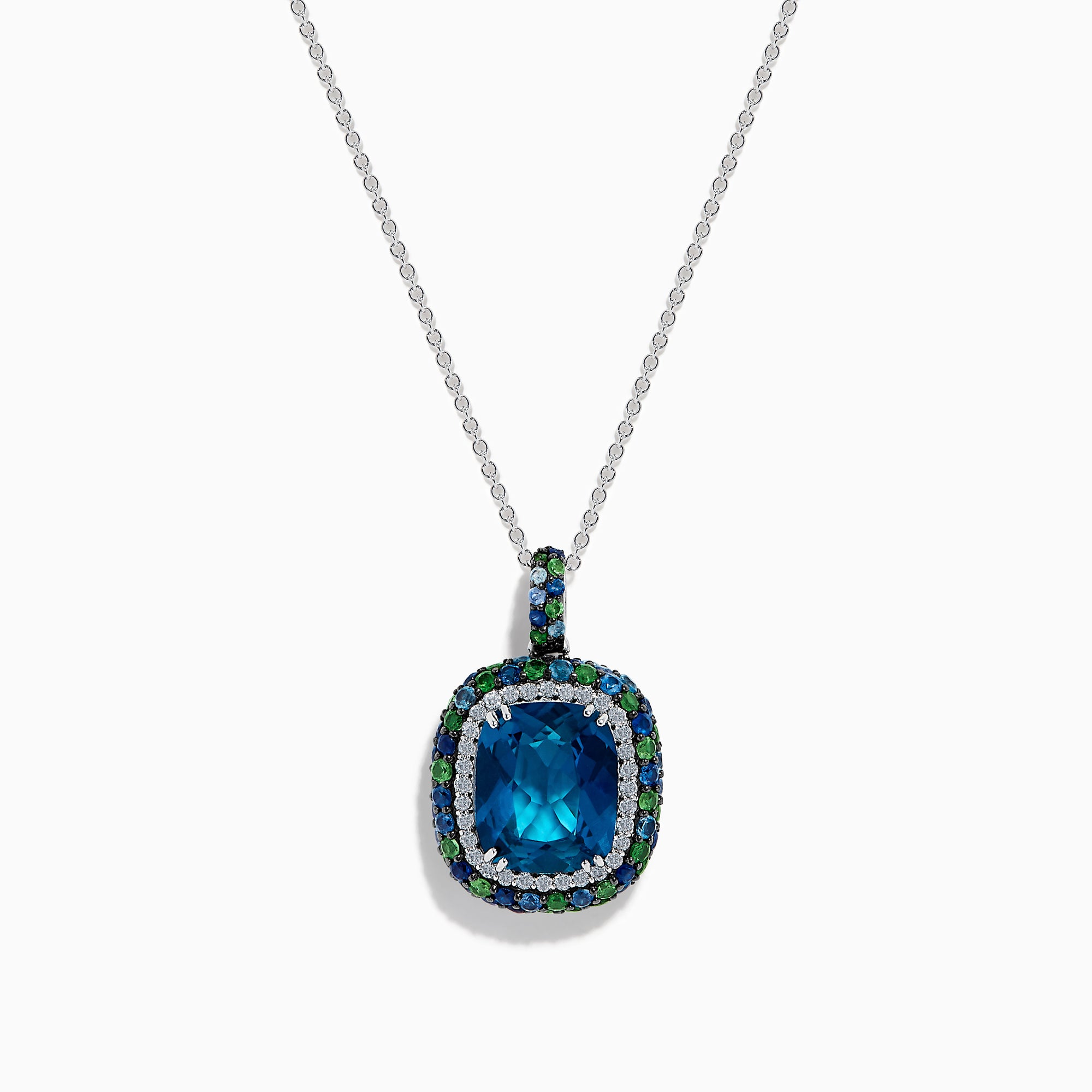 The 925 Sterling Silver Blue Topaz Cushion Multi Gemstone Halo Pendant features a cushion-cut blue topaz, accented by small blue and green stones in a striking halo design.