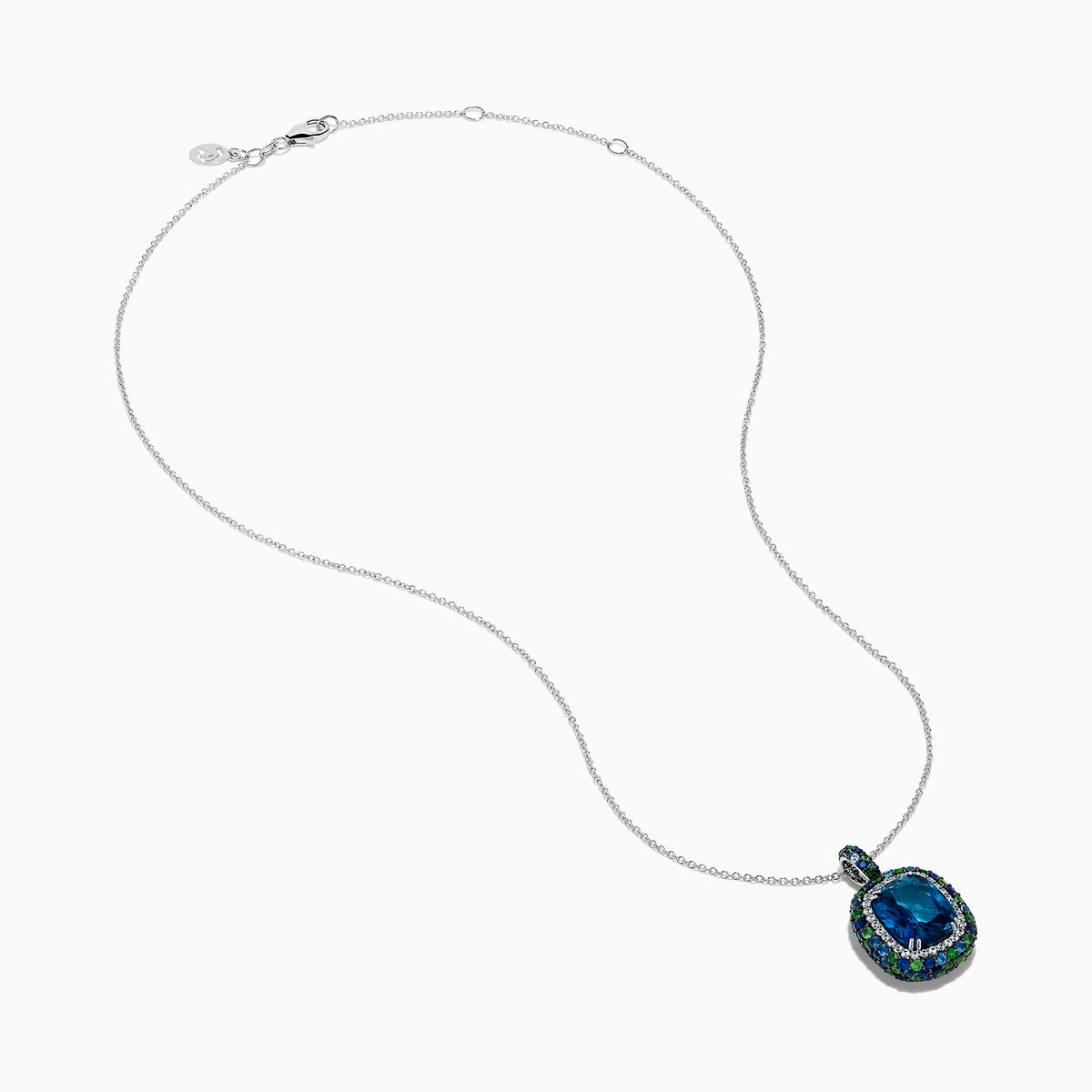 The 925 Sterling Silver Blue Topaz Cushion Multi Gemstone Halo Pendant features a cushion-cut blue topaz, accented by small blue and green stones in a striking halo design.