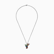 The 925 Safari Sterling Silver Multi Sapphires Humming Bird Pendant features a sterling silver chain and a pendant adorned with green, blue, yellow, and red sapphires that accentuate the bird’s wings, body, and tail.