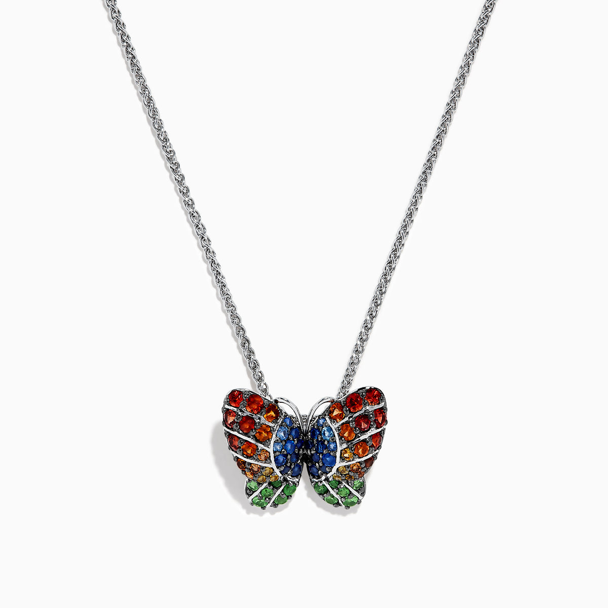 The Nature Sterling Silver Multi Sapphires Butterfly Pendant features a butterfly design with red, blue, and green sapphires, showcased on a white background.