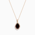 The 14K Rose Gold Garnet and Diamond Pendant features a teardrop-shaped deep red garnet accented by a halo of sparkling diamonds on a delicate rose gold chain.