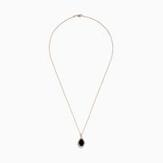 The 14K Rose Gold Garnet and Diamond Pendant features a teardrop-shaped deep red garnet accented by a halo of sparkling diamonds on a delicate rose gold chain.