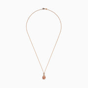 The Blush 14K Rose Gold Morganite and Diamond Teardrop Pendant showcases a teardrop morganite center, encircled by diamonds, with a round diamond cluster above, set against a white background.