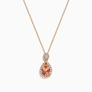 The Blush 14K Rose Gold Morganite and Diamond Teardrop Pendant showcases a teardrop morganite center, encircled by diamonds, with a round diamond cluster above, set against a white background.