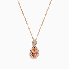 The Blush 14K Rose Gold Morganite and Diamond Teardrop Pendant showcases a teardrop morganite center, encircled by diamonds, with a round diamond cluster above, set against a white background.