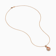 The Blush 14K Rose Gold Morganite and Diamond Teardrop Pendant showcases a teardrop morganite center, encircled by diamonds, with a round diamond cluster above, set against a white background.