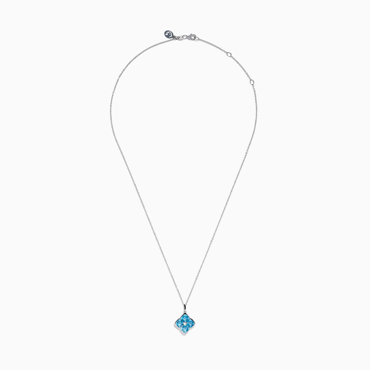 The Ocean Bleu 14K White Gold Blue Topaz and Diamond Pendant features a delicate chain and a four-petal flower blue topaz pendant accented with sparkling gemstones and a central diamond, set against a white background.