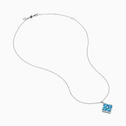 The Ocean Bleu 14K White Gold Blue Topaz and Diamond Pendant features a delicate chain and a four-petal flower blue topaz pendant accented with sparkling gemstones and a central diamond, set against a white background.