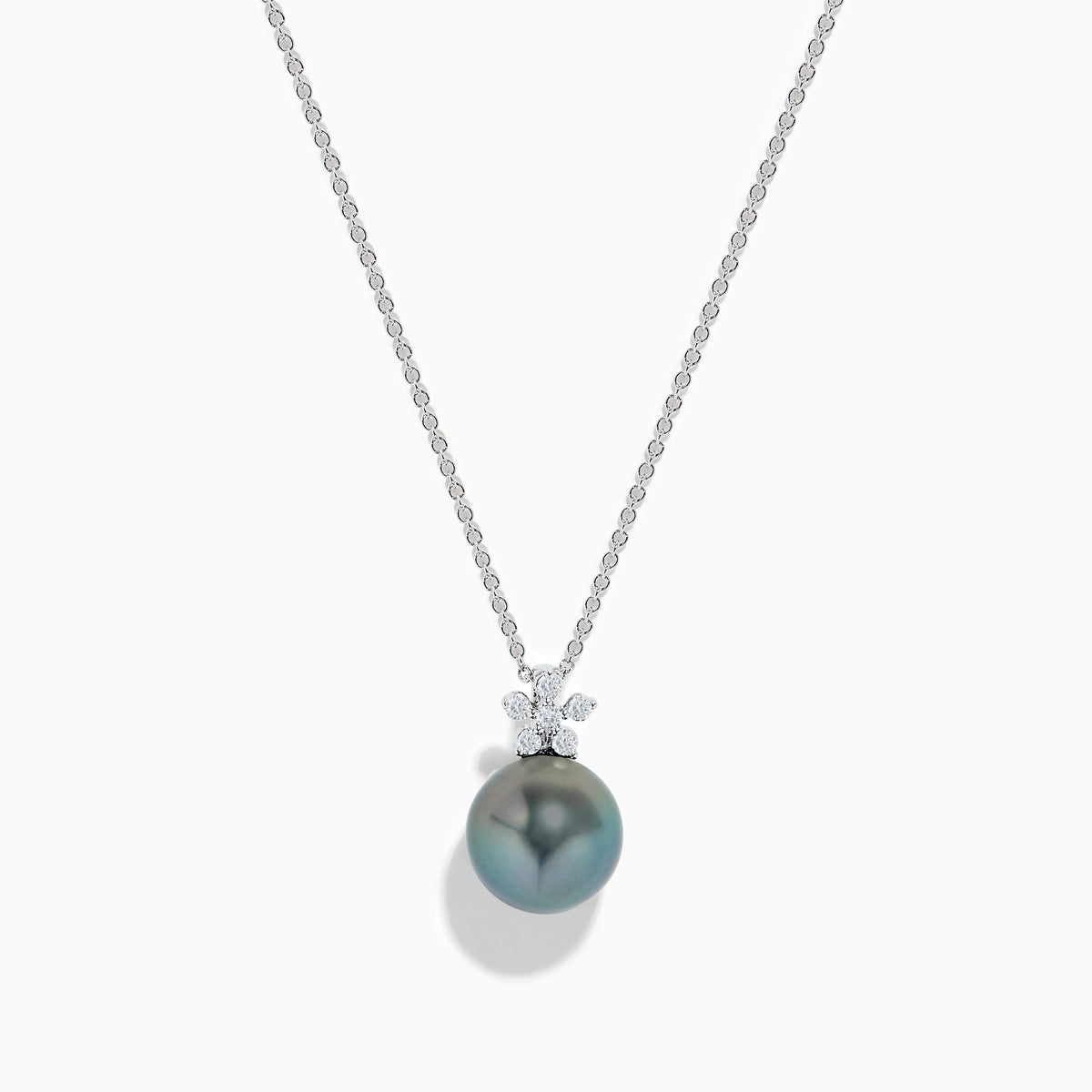 The 14K White Gold Tahitian Pearl and Diamond Pendant showcases a round Tahitian pearl with three sparkling diamonds above it, all set in lustrous white gold and displayed against a plain white background.