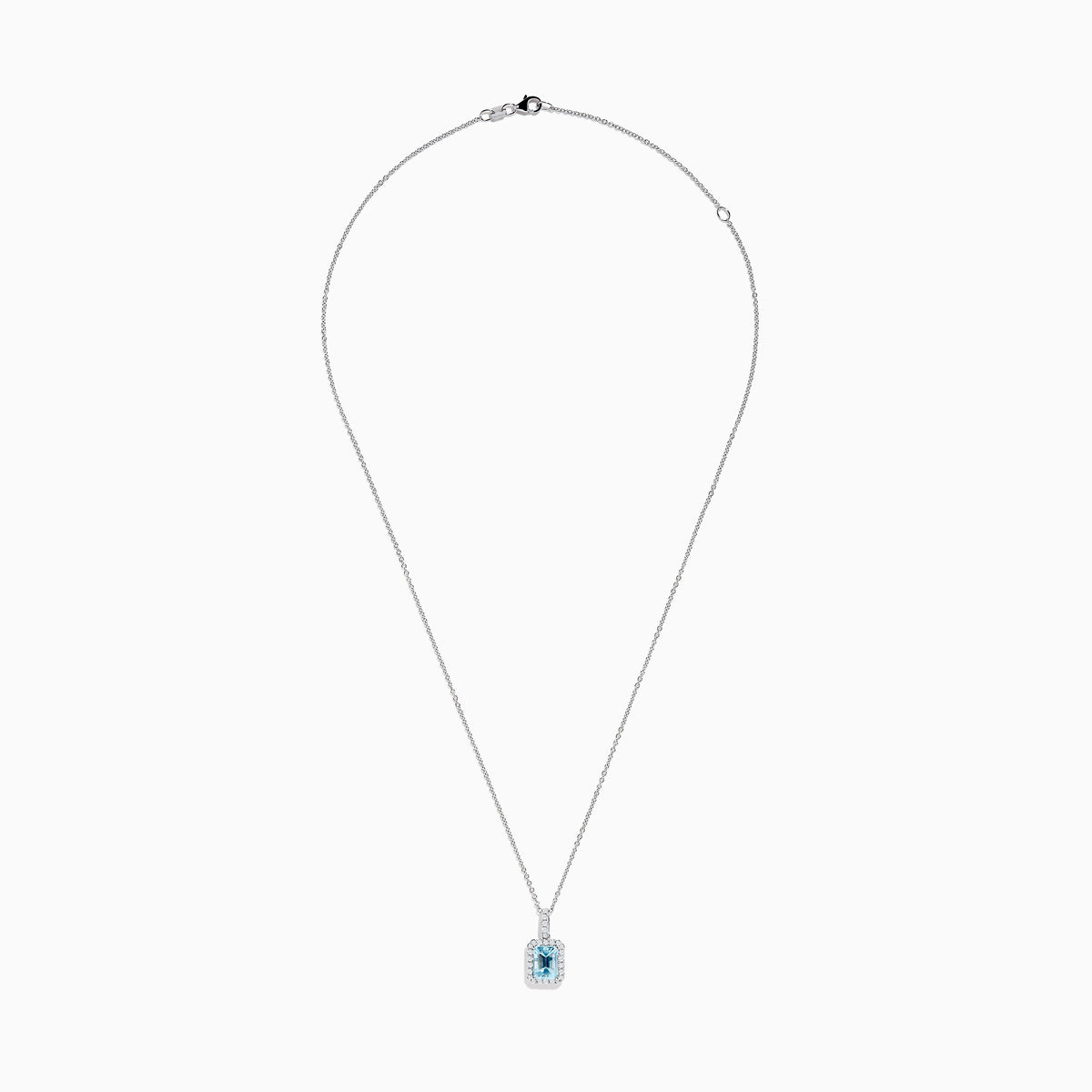 The Aquarius 14K White Gold Aquamarine and Diamond Halo Pendant features a rectangular faceted aquamarine surrounded by a sparkling diamond halo, elegantly suspended from a fine white gold chain.
