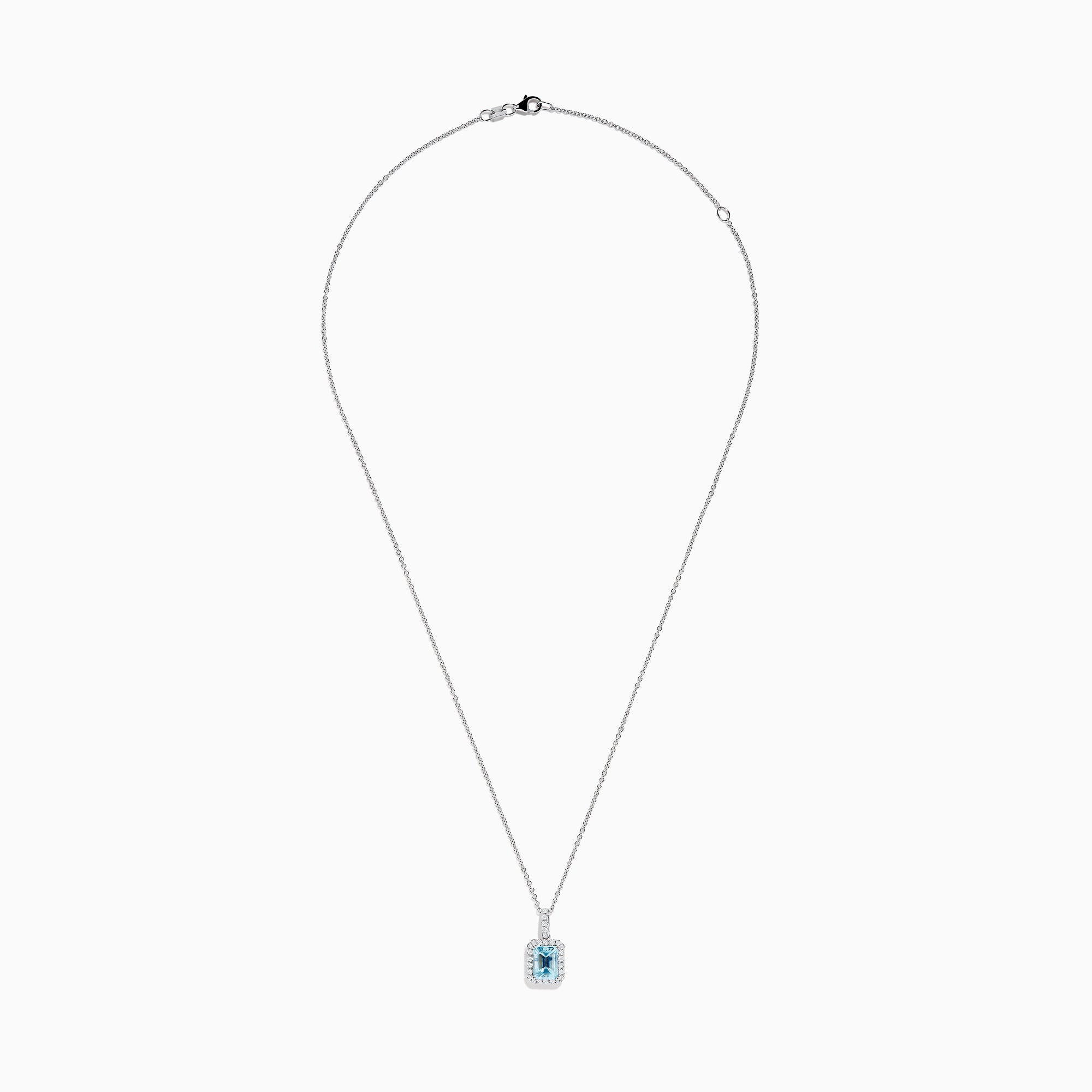 The Aquarius 14K White Gold Aquamarine and Diamond Halo Pendant features a rectangular faceted aquamarine surrounded by a sparkling diamond halo, elegantly suspended from a fine white gold chain.