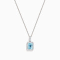 The Aquarius 14K White Gold Aquamarine and Diamond Halo Pendant features a rectangular faceted aquamarine surrounded by a sparkling diamond halo, elegantly suspended from a fine white gold chain.