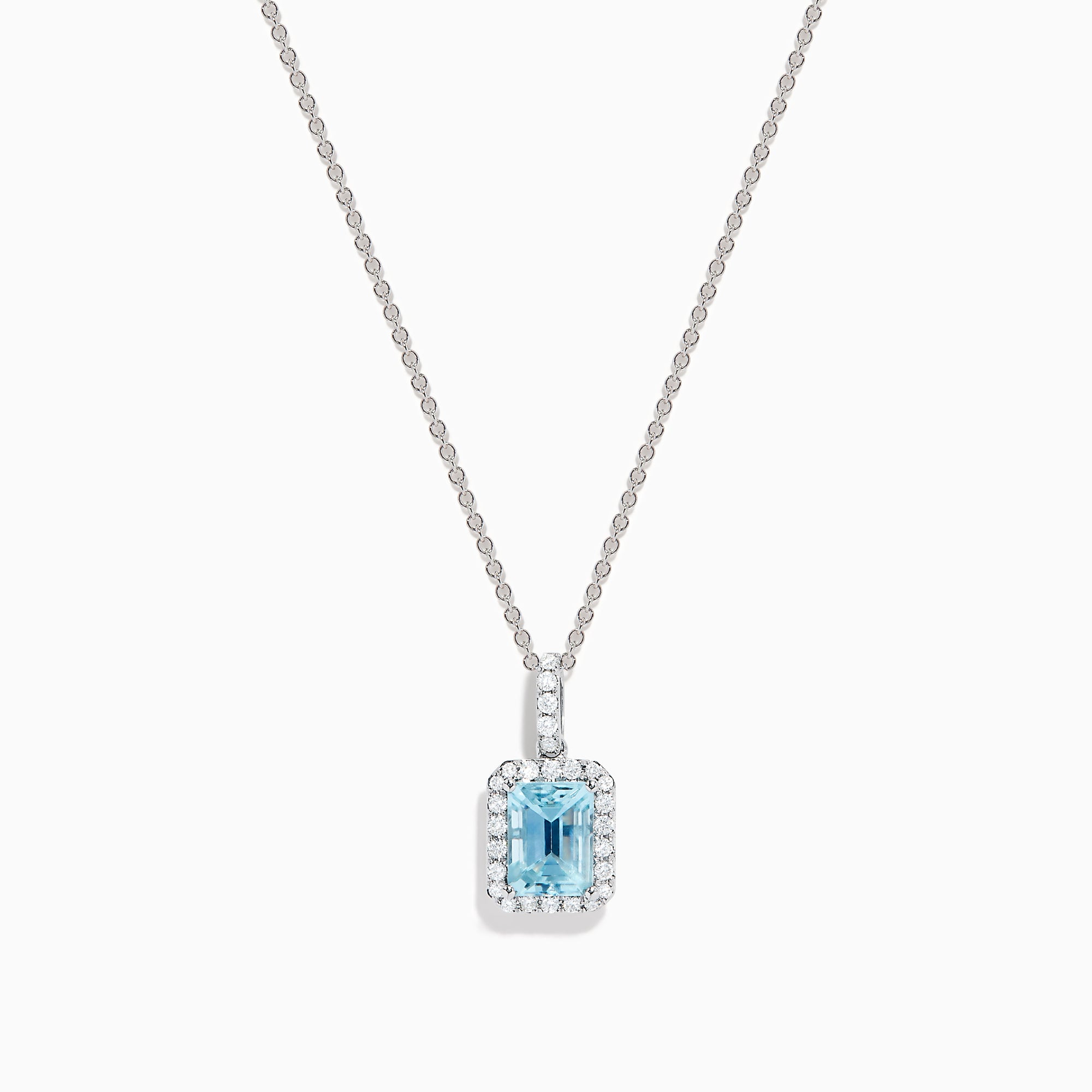 The Aquarius 14K White Gold Aquamarine and Diamond Halo Pendant features a rectangular faceted aquamarine surrounded by a sparkling diamond halo, elegantly suspended from a fine white gold chain.