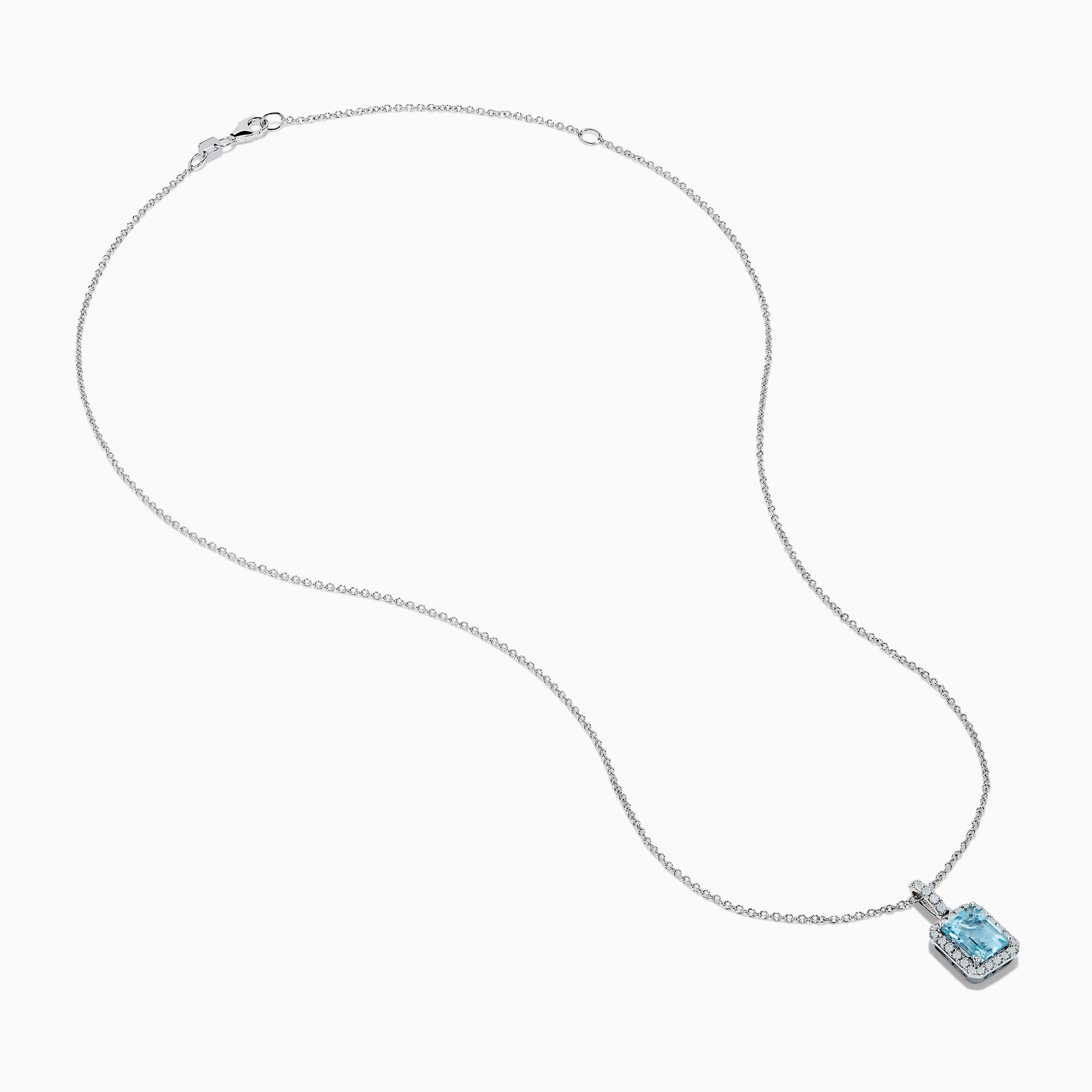The Aquarius 14K White Gold Aquamarine and Diamond Halo Pendant features a rectangular faceted aquamarine surrounded by a sparkling diamond halo, elegantly suspended from a fine white gold chain.