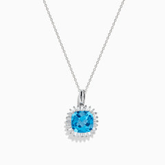 The 14K White Gold Blue Topaz and Diamond Pendant features a square-cut blue topaz accented by a halo of sparkling diamonds, all suspended from a delicate chain.
