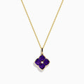 The 14K Yellow Gold Amethyst and Diamond Pendant features a four-petal flower design with deep purple amethysts and a small central diamond on a yellow gold chain.