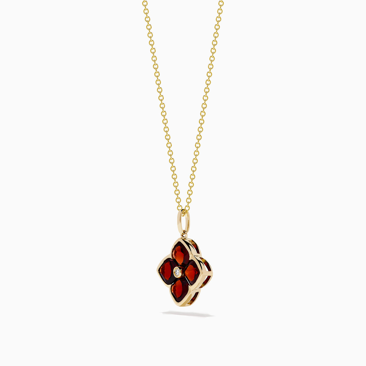 The 14K Yellow Gold Garnet and Diamond Pendant features a four-petal flower-shaped garnet with deep red gemstones outlined in yellow gold and a small clear diamond at the center, shown on a white background.