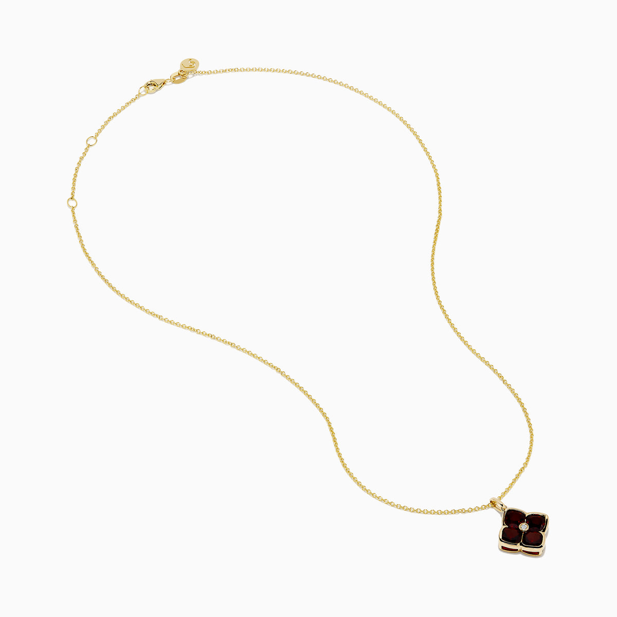 The 14K Yellow Gold Garnet and Diamond Pendant features a four-petal flower-shaped garnet with deep red gemstones outlined in yellow gold and a small clear diamond at the center, shown on a white background.