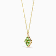 The 14K Yellow Gold Peridot and Diamond Pendant features four peridots in a floral design around a central diamond, presented on a white background.