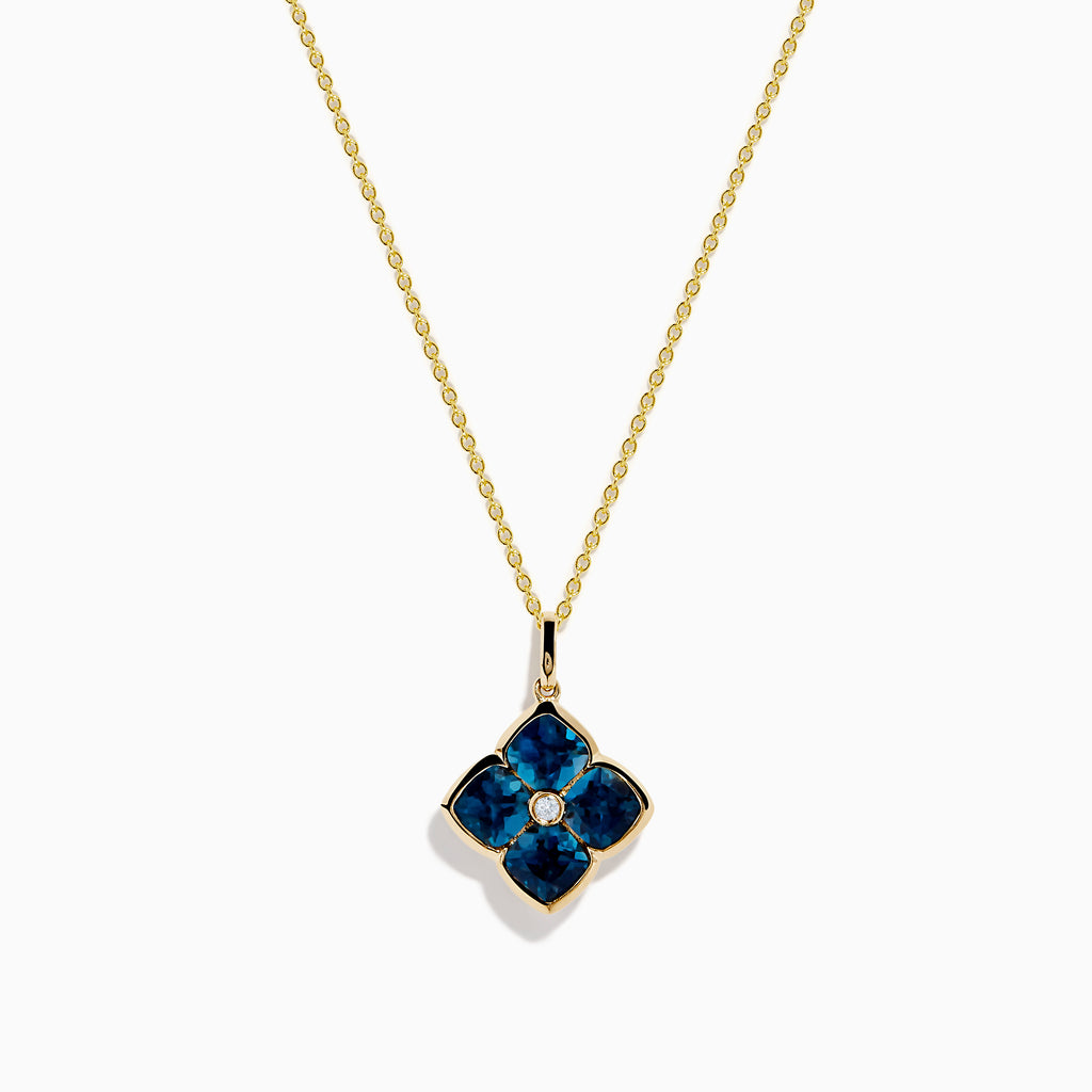The Ocean Bleu 14K Yellow Gold London Blue Topaz and Diamond Pendant features a clover-shaped design with four London Blue Topaz gemstones and a central diamond on a yellow gold chain necklace.