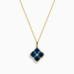 The Ocean Bleu 14K Yellow Gold London Blue Topaz and Diamond Pendant features a clover-shaped design with four London Blue Topaz gemstones and a central diamond on a yellow gold chain necklace.