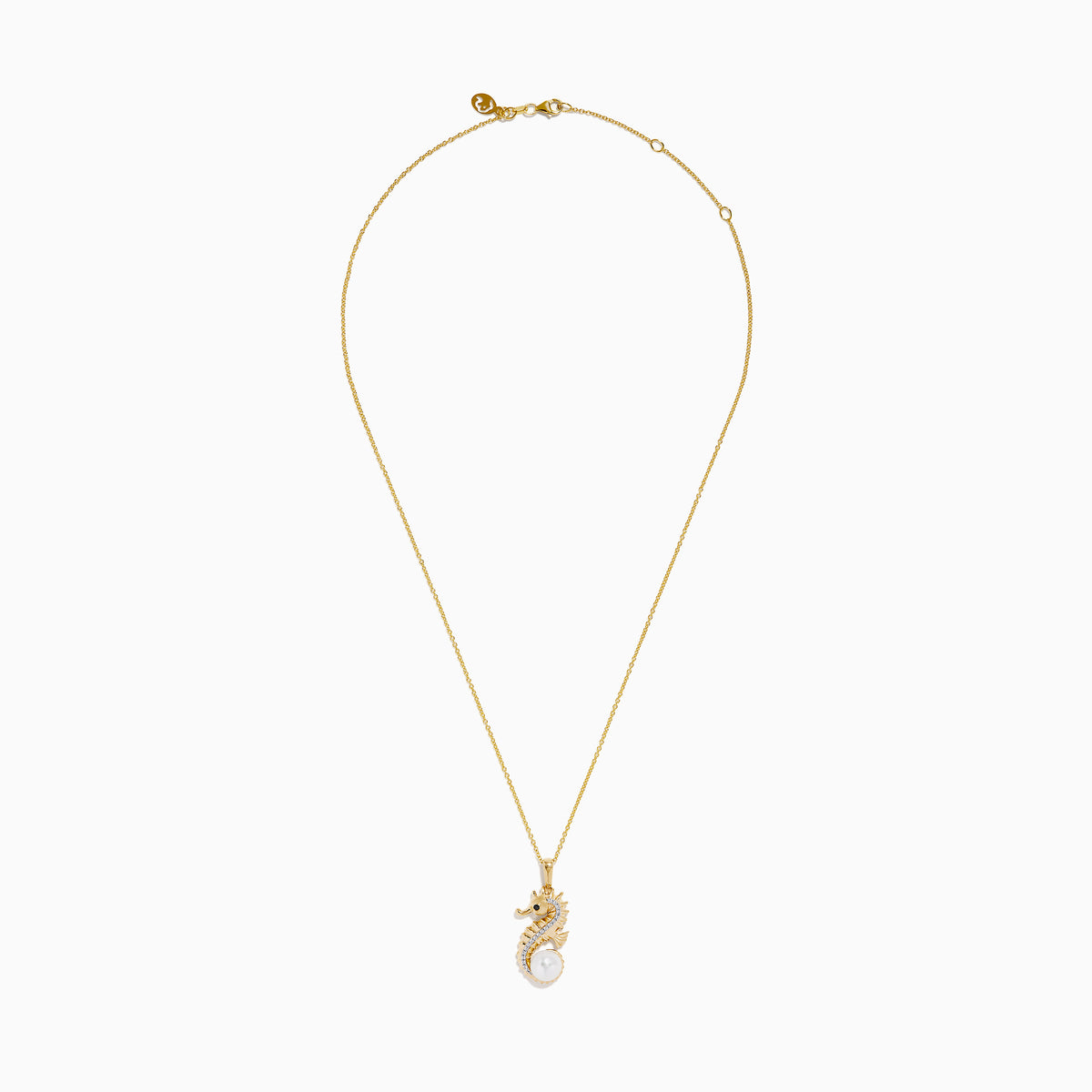 The Novelty 14K Yellow Gold Sea Horse Pendant features white and black diamonds along the body, a round pearl at the tail, and hangs elegantly from a gold chain on a white background.