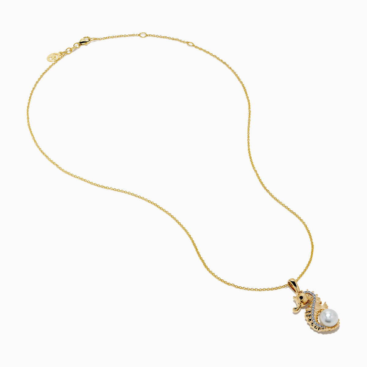 The Novelty 14K Yellow Gold Sea Horse Pendant features white and black diamonds along the body, a round pearl at the tail, and hangs elegantly from a gold chain on a white background.