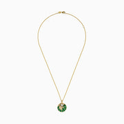 The 14K Yellow Gold Malachite and Diamond Inlay Pendant features a circular malachite centerpiece with gold accents and small diamonds, hanging from a delicate gold chain.