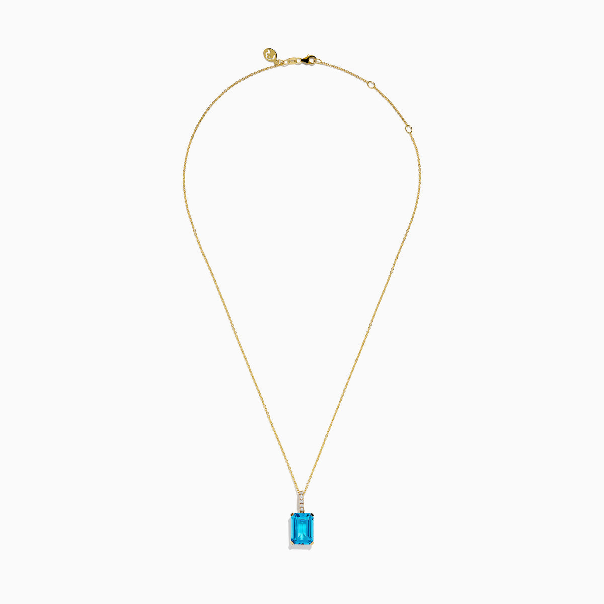 The 14K Yellow Gold Blue Topaz and Diamond Pendant features a large emerald-cut blue topaz accented by a vertical row of sparkling white diamonds for an elegant, polished look.