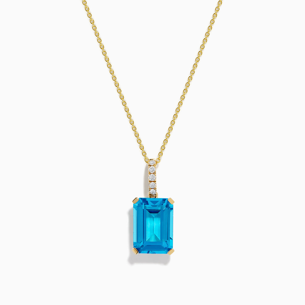 The 14K Yellow Gold Blue Topaz and Diamond Pendant features a large emerald-cut blue topaz accented by a vertical row of sparkling white diamonds for an elegant, polished look.