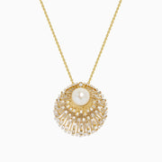 The 14K Yellow Gold Freshwater Pearl and Diamond Sunburst Pendant features a central freshwater pearl accented by diamonds and radiant gold details, all on a fine 14K yellow gold chain.