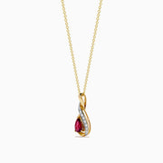 The 14K Yellow Gold Rhodolite and Diamond Pendant features a teardrop-shaped rhodolite, an elegant intertwined design, and is accented by a curved row of small diamonds.