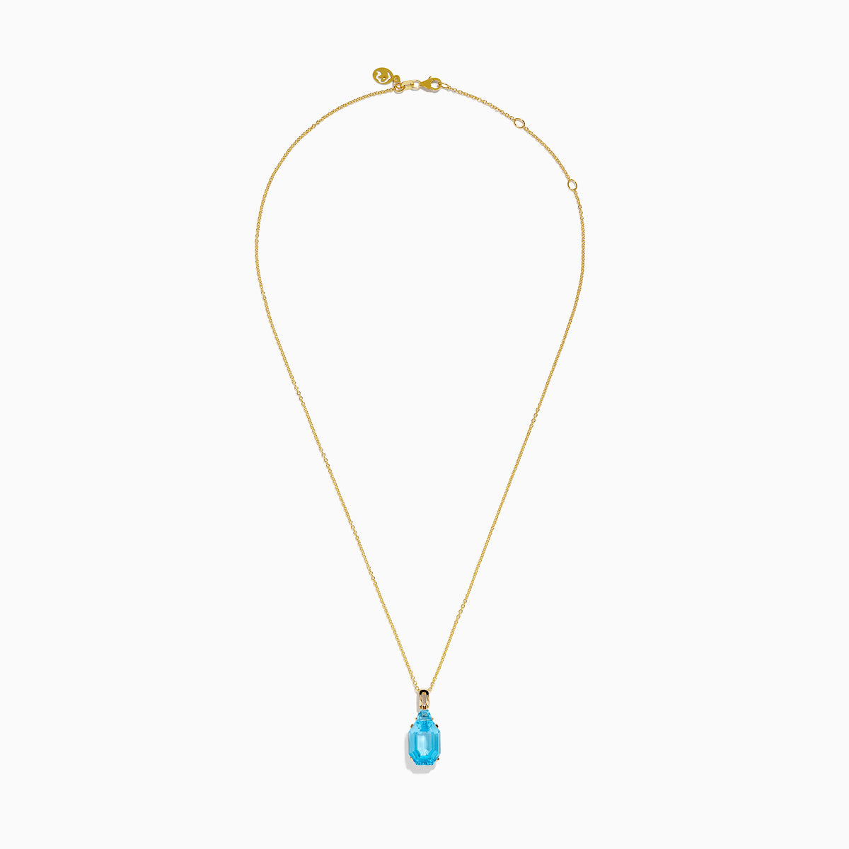 The Ocean Bleu 14K Yellow Gold Blue Topaz Pendant features an emerald-cut blue topaz in gold prongs, showcased on a gold chain against a white background.