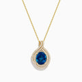 The Ocean Blue 14K Gold London Blue Topaz and Diamond Pendant features an oval-shaped topaz with a diamond teardrop design, accented by two rows of sparkling white diamonds.