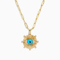 The 14K Yellow Gold Turquoise and Diamond Evil Eye Pendant features a sunburst design with a vivid blue and black evil eye center, accented by sparkling diamonds along the edges.