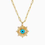 The 14K Yellow Gold Turquoise and Diamond Evil Eye Pendant features a sunburst design with a vivid blue and black evil eye center, accented by sparkling diamonds along the edges.