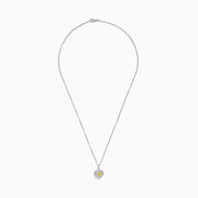 The 18K Two Tone Gold GIA Certified Yellow and White Diamond Heart Pendant features a radiant yellow center diamond surrounded by sparkling white diamonds, blending elegant charm with timeless beauty.
