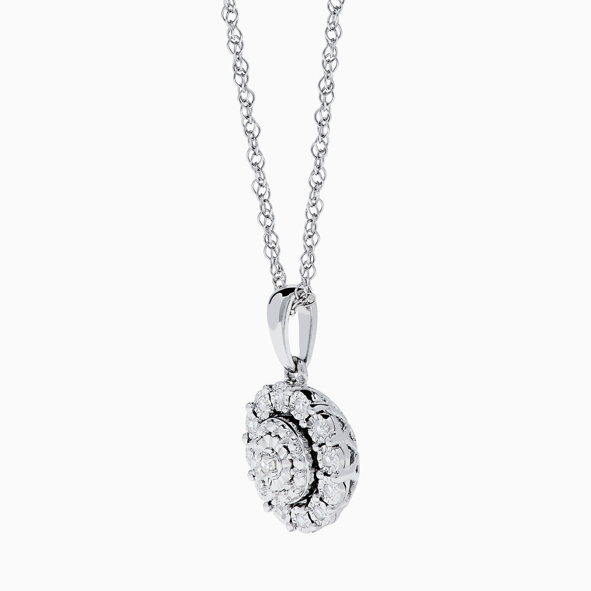 The Sterling Silver Diamond Cluster Pendant showcases a round center diamond encircled by two halos of smaller diamonds, all set in sterling silver, and is displayed on a white background.