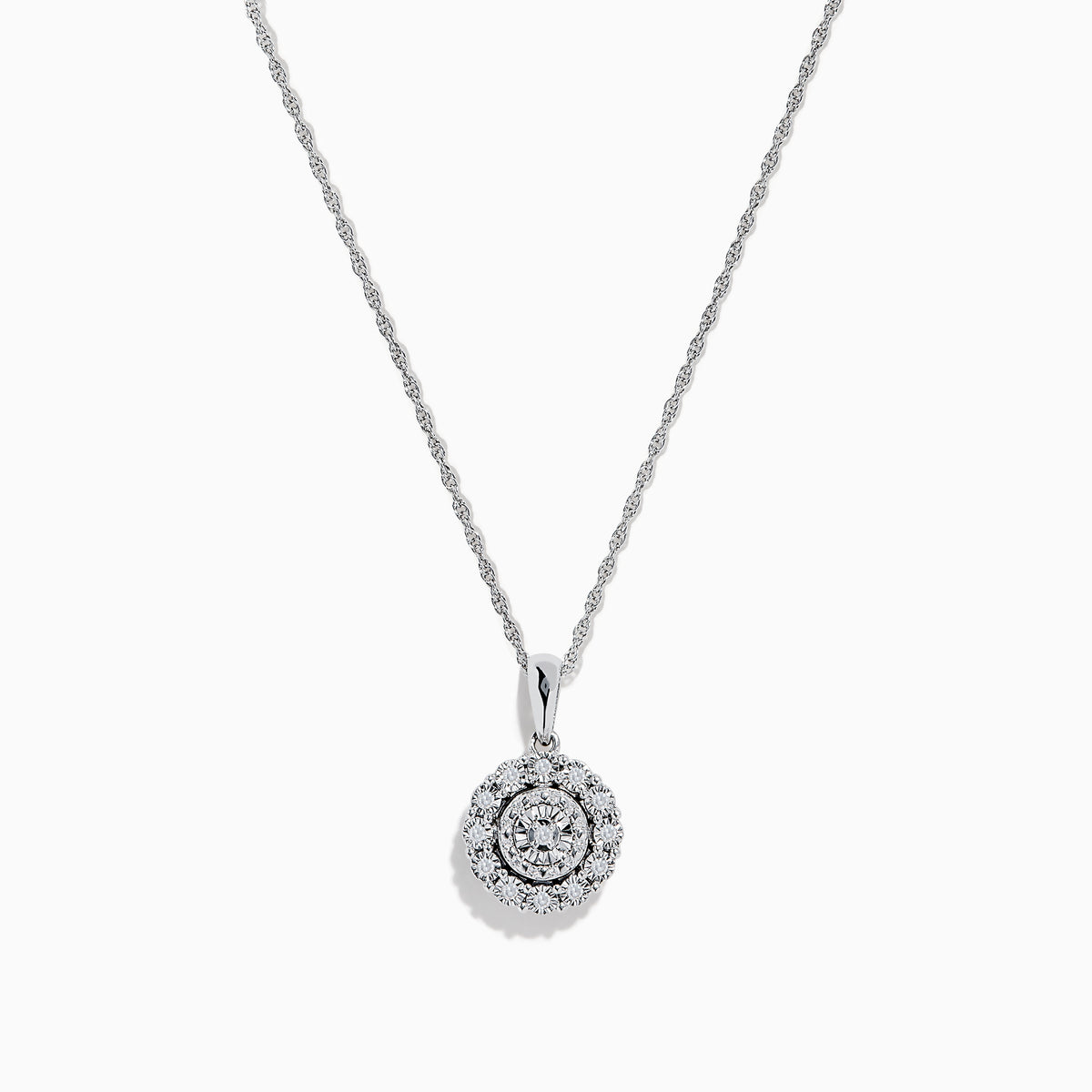 The Sterling Silver Diamond Cluster Pendant showcases a round center diamond encircled by two halos of smaller diamonds, all set in sterling silver, and is displayed on a white background.