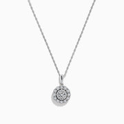 The Sterling Silver Diamond Cluster Pendant showcases a round center diamond encircled by two halos of smaller diamonds, all set in sterling silver, and is displayed on a white background.