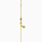 The Brasilica 18K Yellow Gold Emerald and Diamond Pendant features an emerald-cut green gemstone surrounded by small diamonds, showcased on a chain against a plain white background.