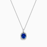 The Effy Hematian 18K White Gold Sapphire and Diamond Halo Pendant features a cushion-cut deep blue sapphire surrounded by sparkling diamonds, showcased on a plain white background.