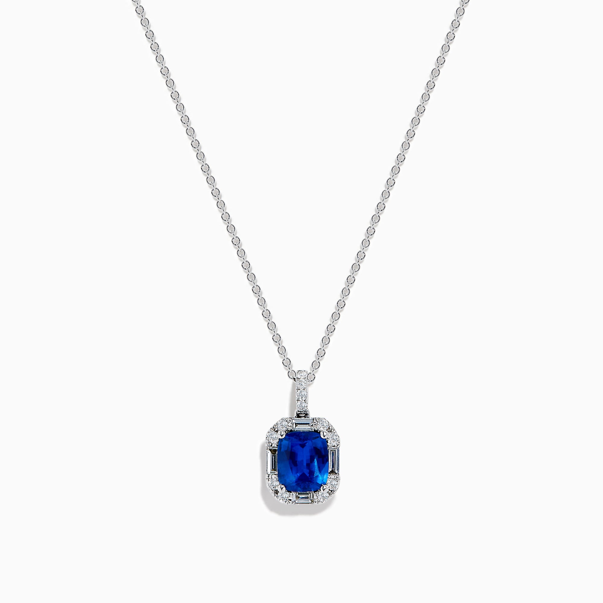 The Effy Hematian 18K White Gold Sapphire and Diamond Halo Pendant features a cushion-cut deep blue sapphire surrounded by sparkling diamonds, showcased on a plain white background.