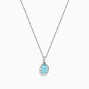Effy Hematian 14K White Gold Paraiba and Diamond Halo Pendant features an oval blue Paraiba gemstone surrounded by a sparkling diamond halo, showcased on a plain white background.