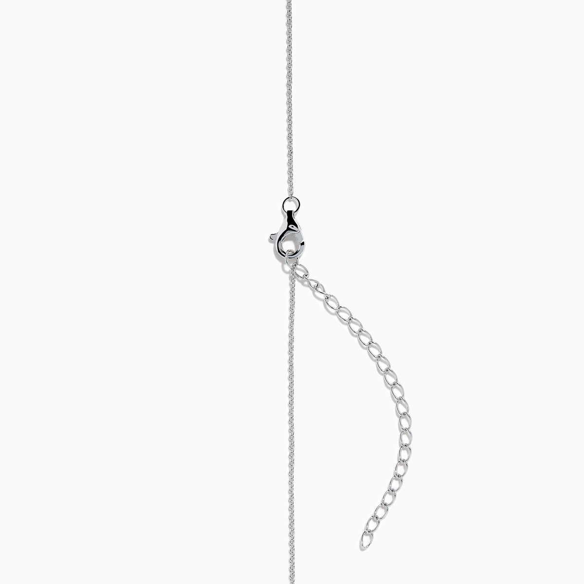 The Nahla Siri 14K Gold Tanzanite and Diamond Pendant features a square blue tanzanite gemstone surrounded by sparkling diamonds, displayed against a white background.